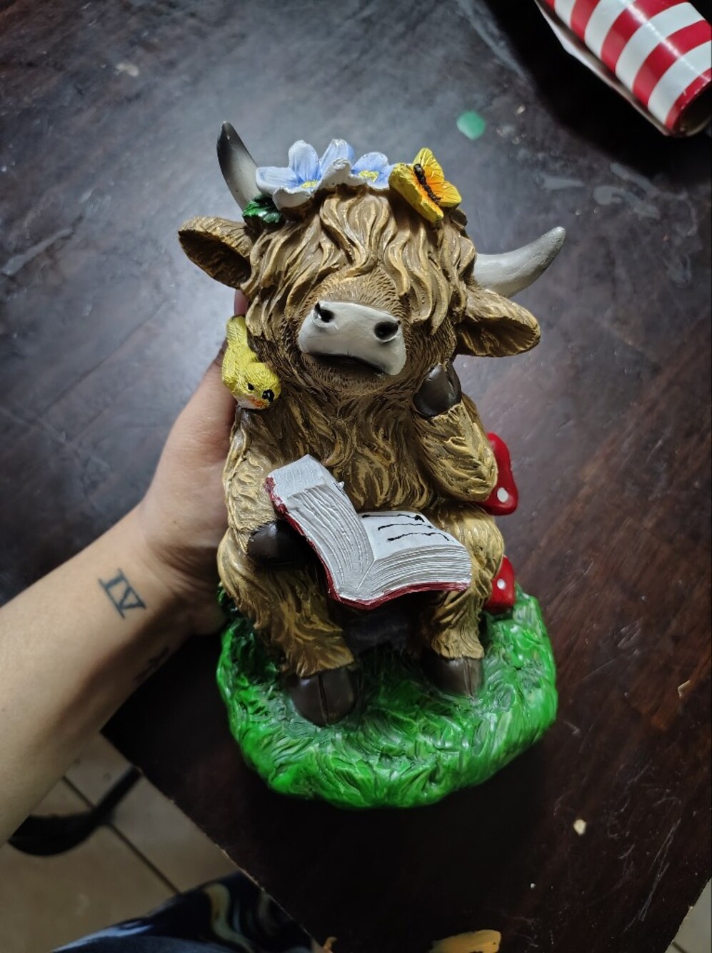 Highland Cow Figurine with Book and Flower Crown - Brown, Green, Red Accents